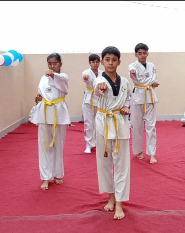Students in stance during a class, Unity Taekwondo Academy
